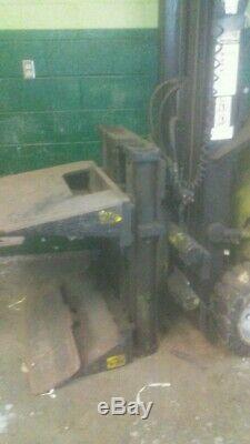 Clark electric forklift with roll clamp and battery charger. Needs battery